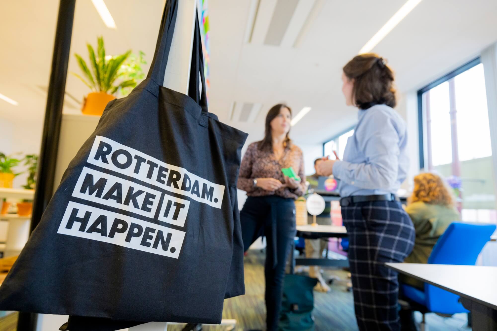 Photo of two women discussing a project.