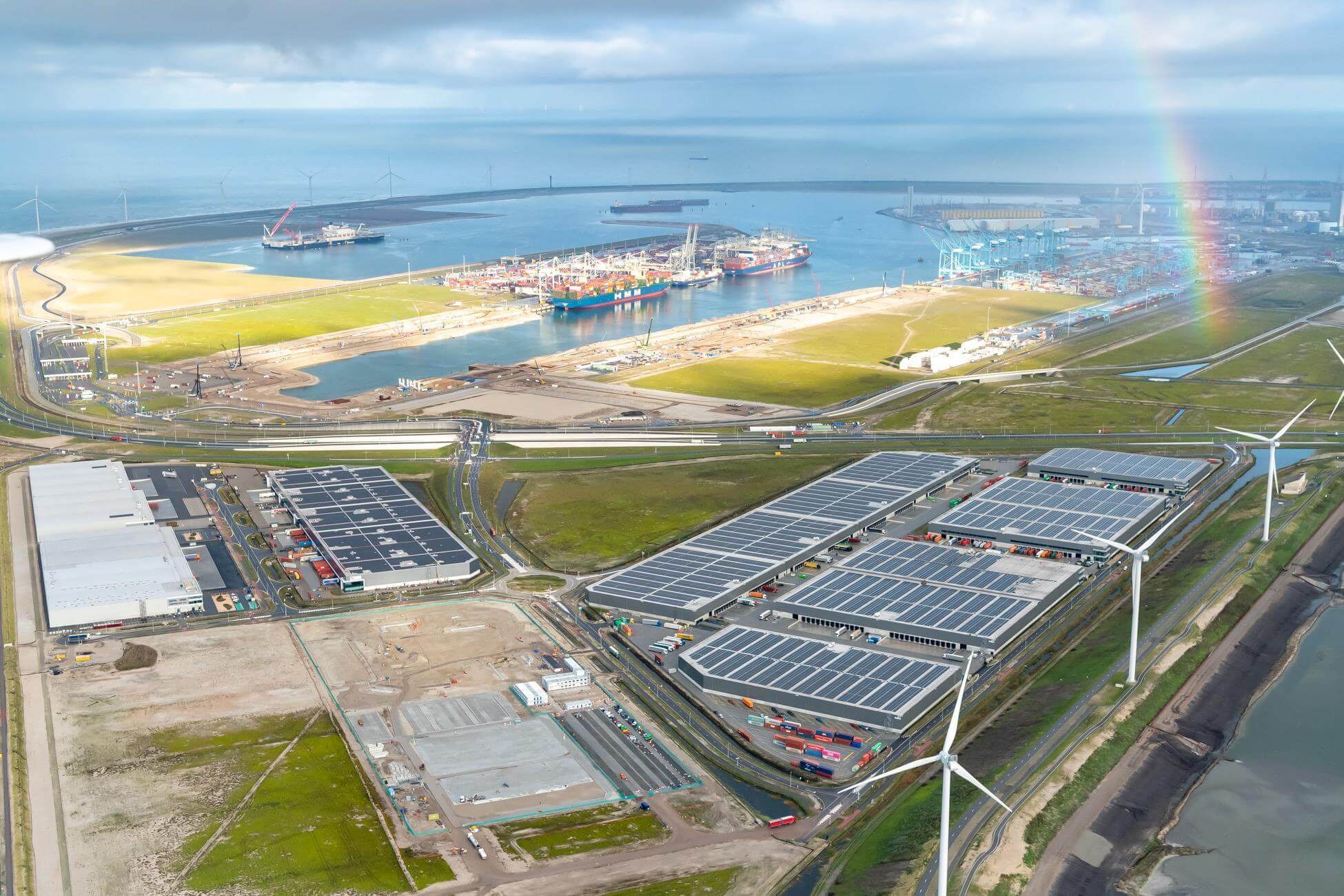 Photo of port of Rotterdam with solar panels, windmills and ships